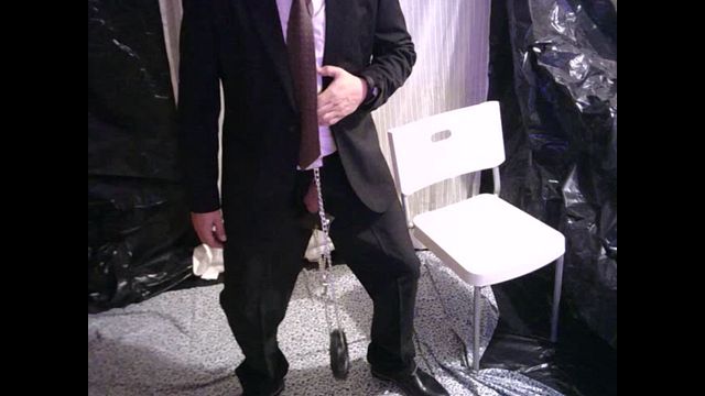 Businessman in Suit Gets Ball Stretched and Pulled