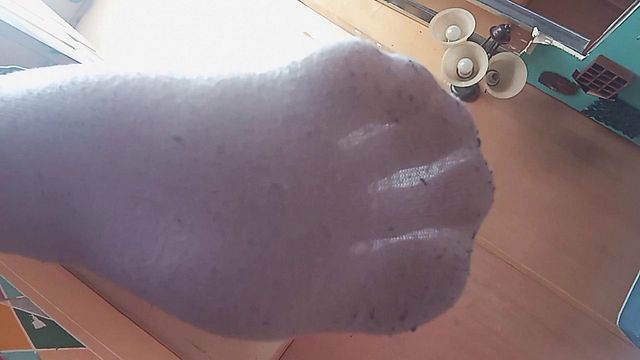 Young twink shows off his feet in solo pose