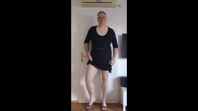 Crossdresser Teases with Seductive Moves