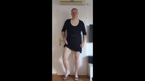 Crossdresser Teases with Seductive Moves