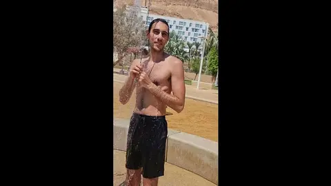Hunky Guy Takes Outdoor Shower with Full Erection