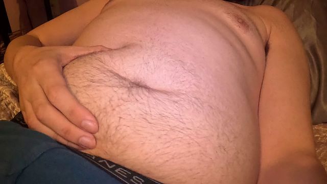 Guy Plays with His Belly Button