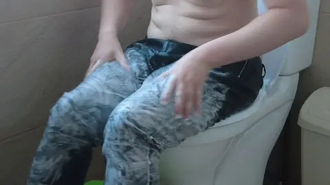 Hunky Guy Rubs Cream on Leather Pants