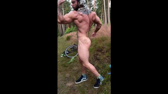 Biker Shows Off Muscles on Trail