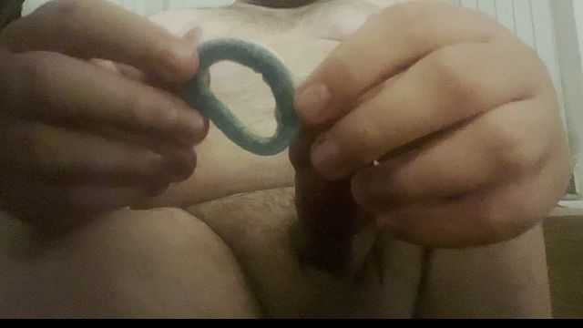 Guy Stretches Gummy Ring with His Erect Cock