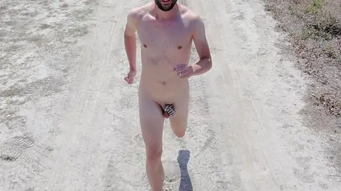 Naked Boy Runs in Chastity Cage