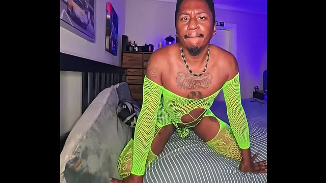 Guy Wears Neon Green Fishnets for Hardcore Action