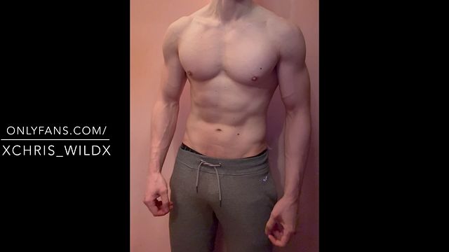 Hunk Shows Off Muscles in Grey Sweatpants