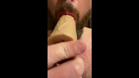 Bearded Bear Gives Blowjob to Toy in Bedroom