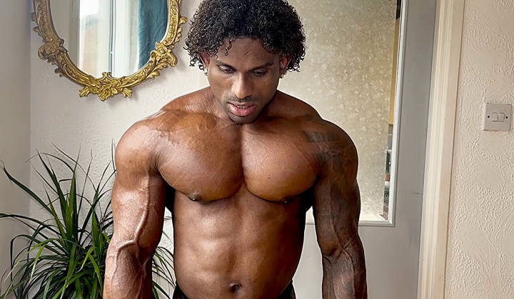 Black Muscular Hunk Flexes His Body