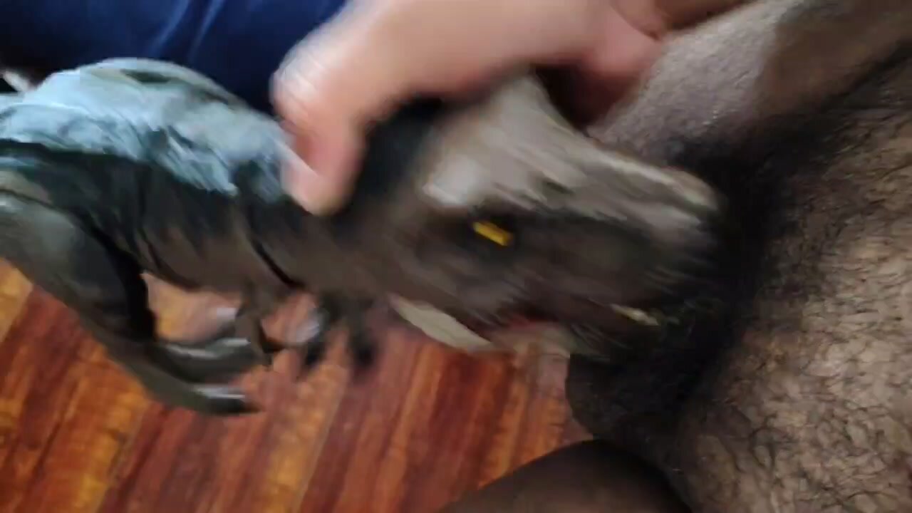 Guy Gets Blowjob with Dino Toy