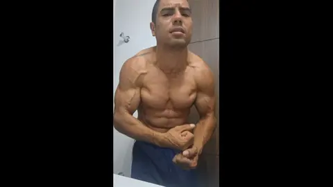 Muscular Guy Flexes His Body