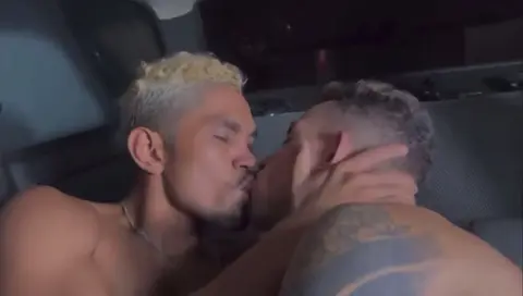 Muscular Men Share Passionate Kiss in Car