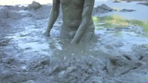 Guy Plays with Mud in His Underwear