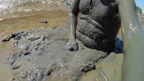 Guy Jerks Off in Mud Outdoor Scene