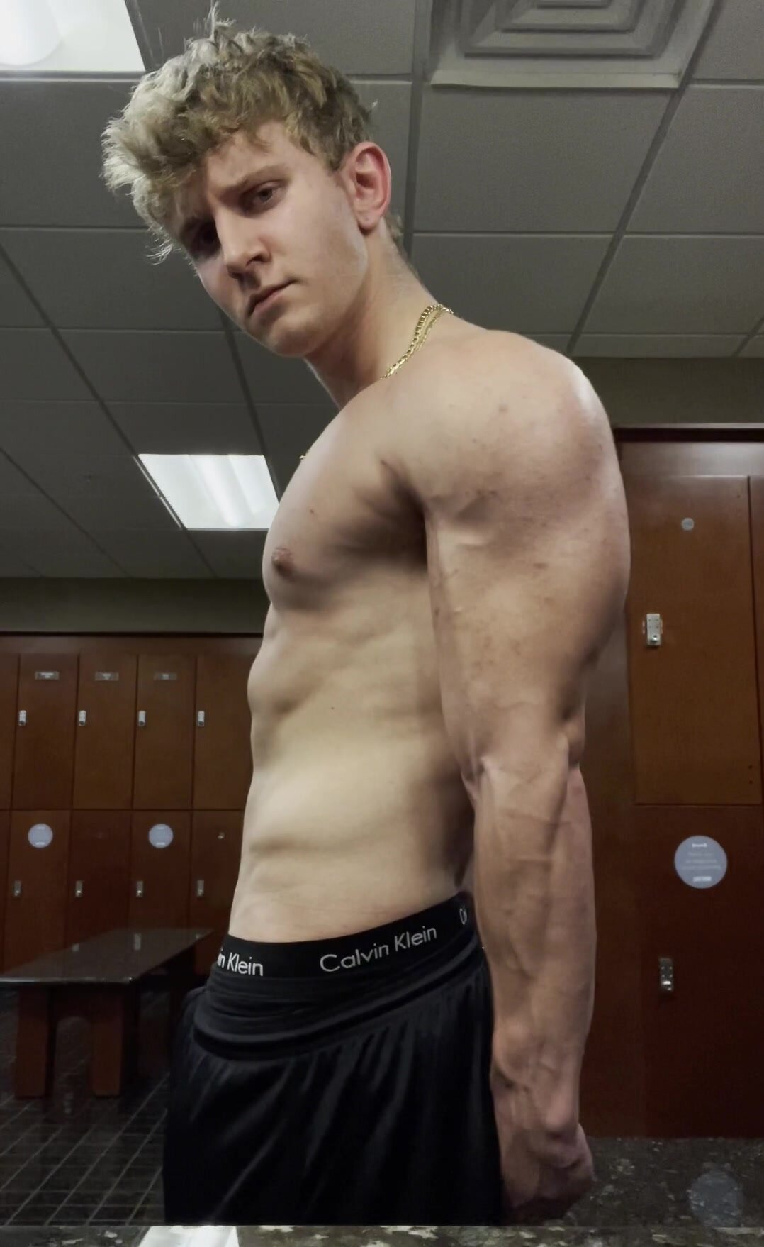 Jock Shows Off Muscles in Gym