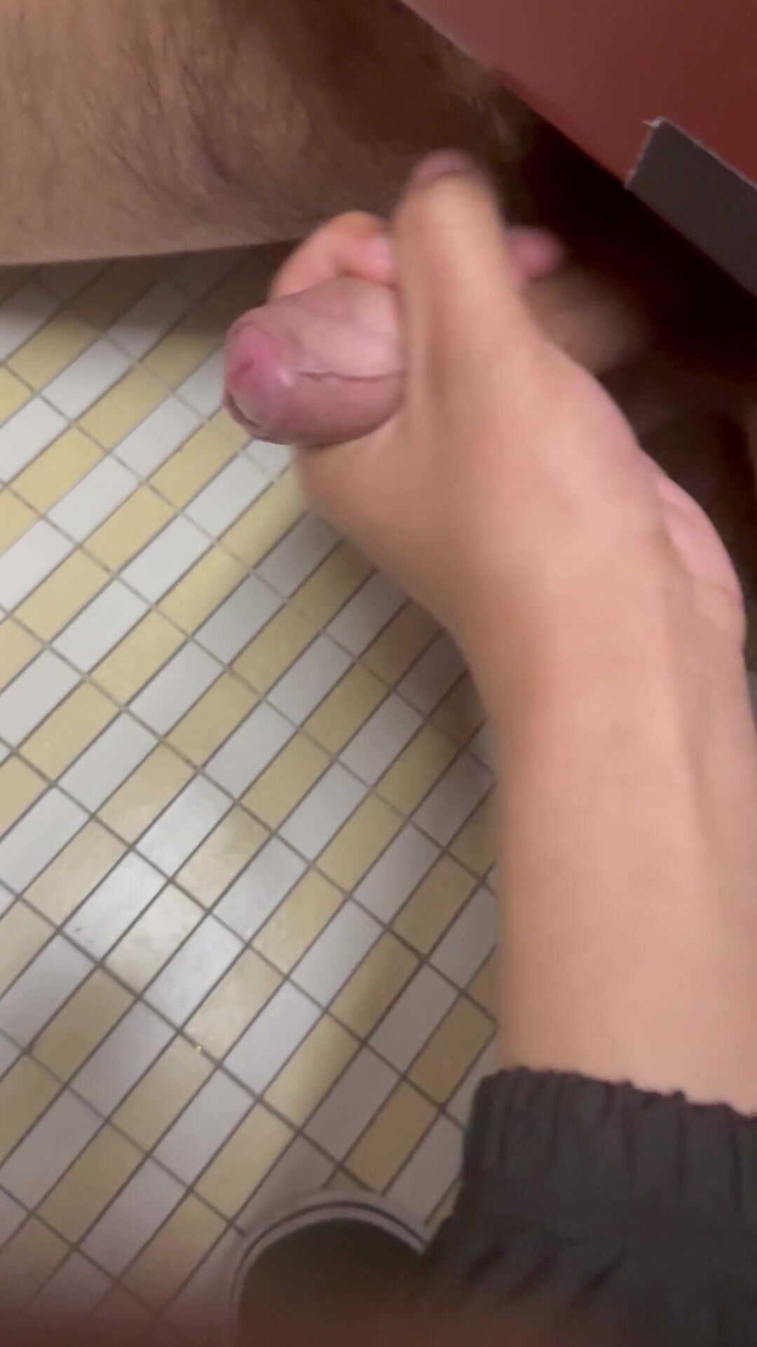 College Guy Gets Handjob Under Stall