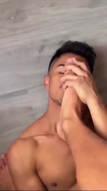 Guy Sniffs Friend's Feet in Intimate Moment