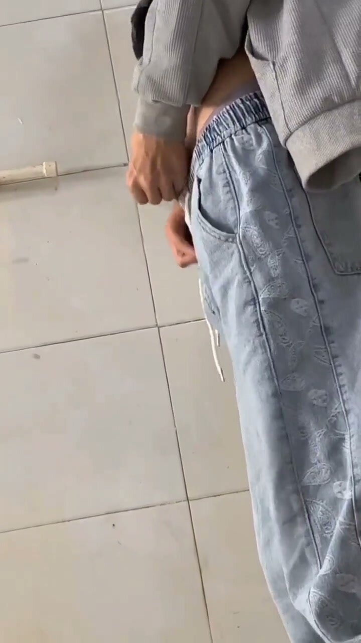 Asian Guys Engage in Pissing Action