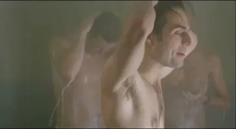 Multiple Men Showering and Bathing in Locker Room Scene