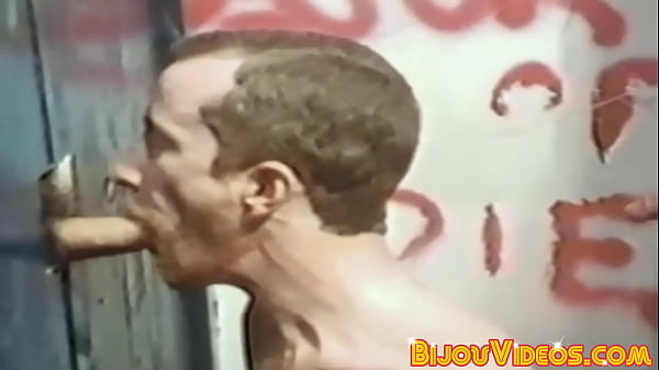 Muscular Gays Engage in Glory Hole Cock Sucking
