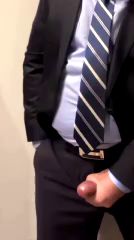 Suit Wearing Guy Masturbates to Big Cumshot