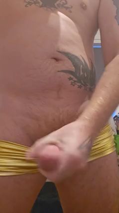 Guy Jerks Off in Gold Hotpants with Cumshot