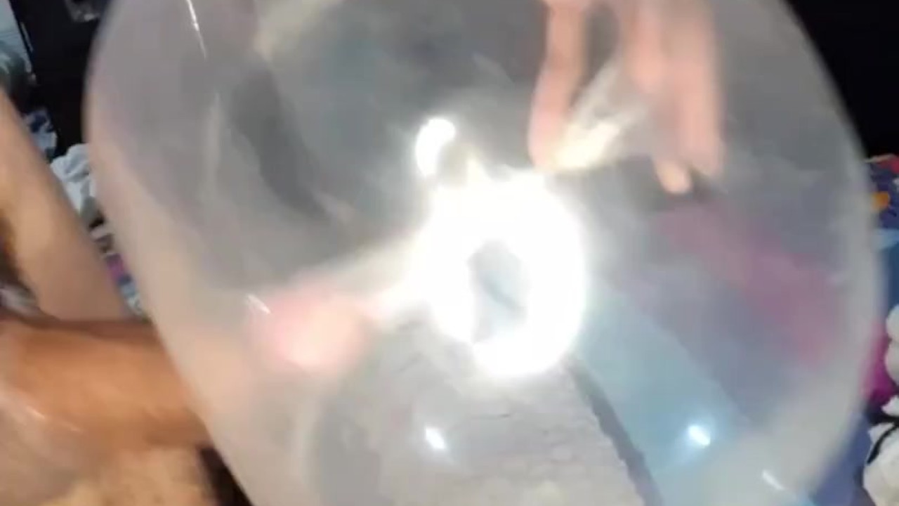 Young Guy Masturbates with Inflated Condom