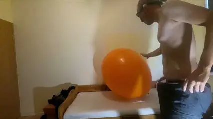 Gay Guy Fucks Inflated Orange Balloon
