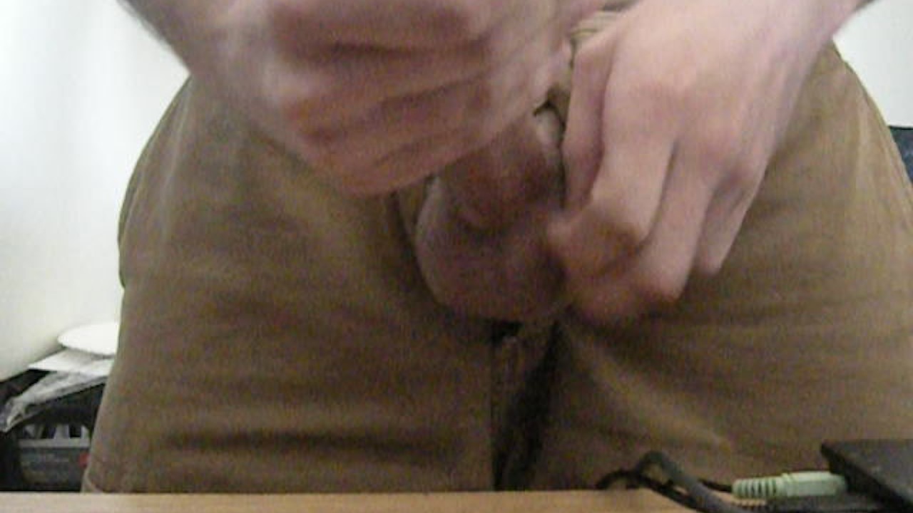 Guy Strokes Cock in Brown Shorts