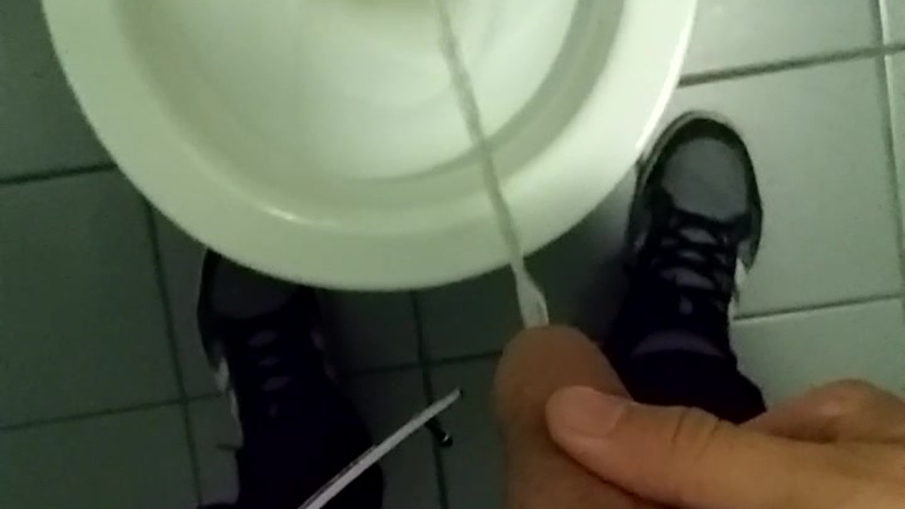 Teen Boy Urinates in Public Restroom