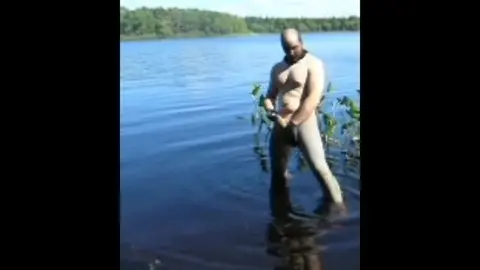 Guy in Spandex and Latex Jerks Off by the Lake
