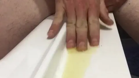 Hunk Wears White Jocks While Pissing & Spraying Body