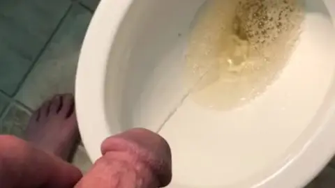 Guy Peeing in Toilet Caught on Camera