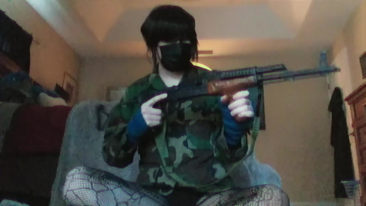Femboy Strips and Plays with AK Rifle