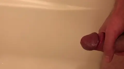 Guy Pisses in Tub, Jerks Off to Cum
