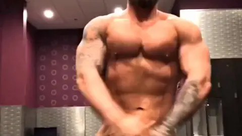 Tattooed Muscle Stud Strips Naked in Locker Room
