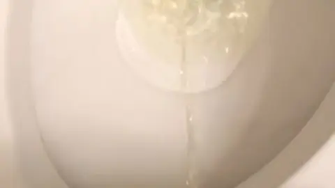 Guy Takes a Piss in Public Restroom