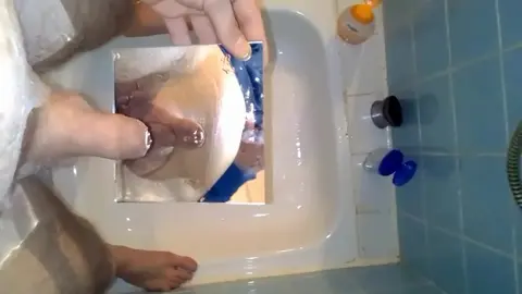 Guy Pisses on Mirror in Fetish Scene