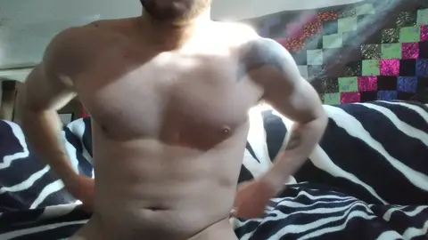 Shirtless Guy Stretches After Waking Up