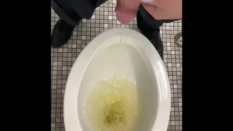 Guy Urinates in Public Restroom
