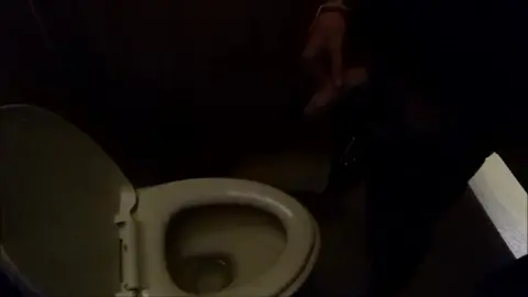 Man Urinates in Public Restroom