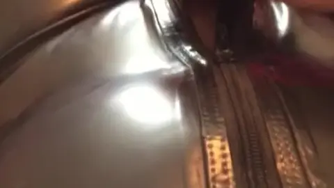 Latex Catsuit Guy Rubs Cock on Satin Sheets