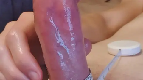 Guy Wraps Measuring Tape Around Erect Cock