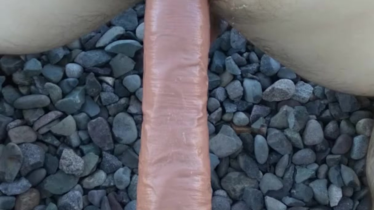 Guy Uses Dildo for Anal Play Outside