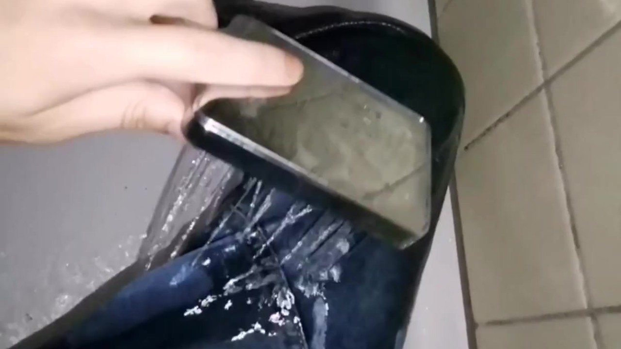Guy Takes Shower Fully Clothed in Jeans
