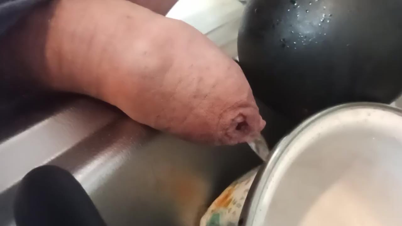 Gay Guy Pisses on Dishes with Foreskin Closeup