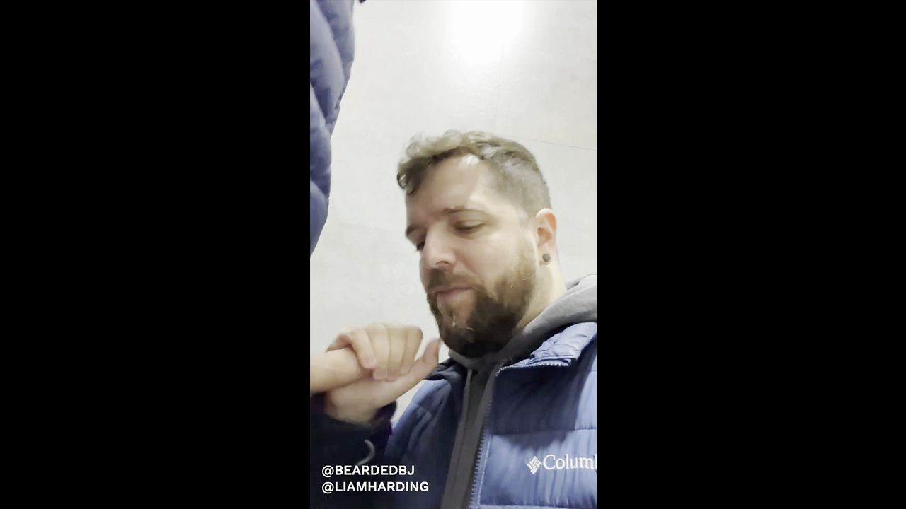 Daddy Gives Hunk Blowjob in Public Bathroom