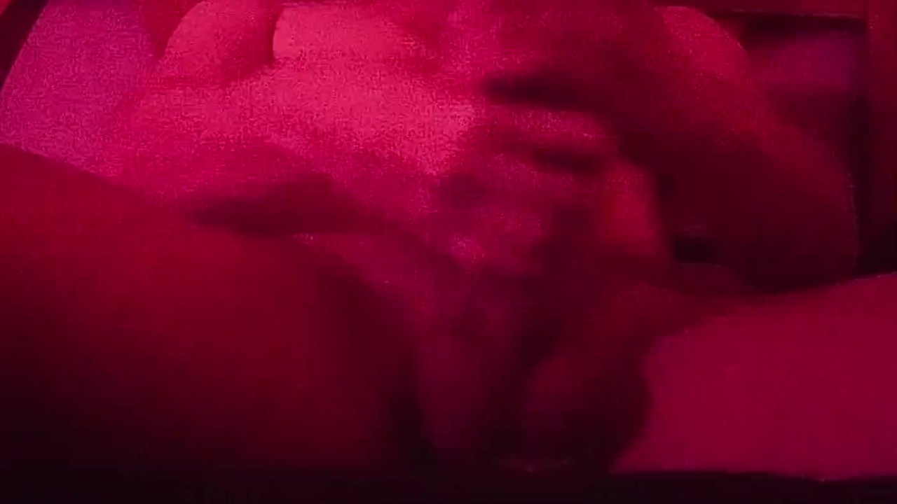 Teenager Exhibits Solo Masturbation Under Red Lighting