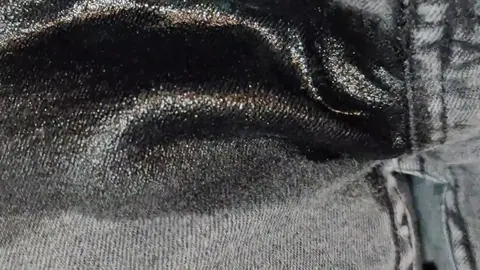 Guy Wets Jeans Sitting On Toilet